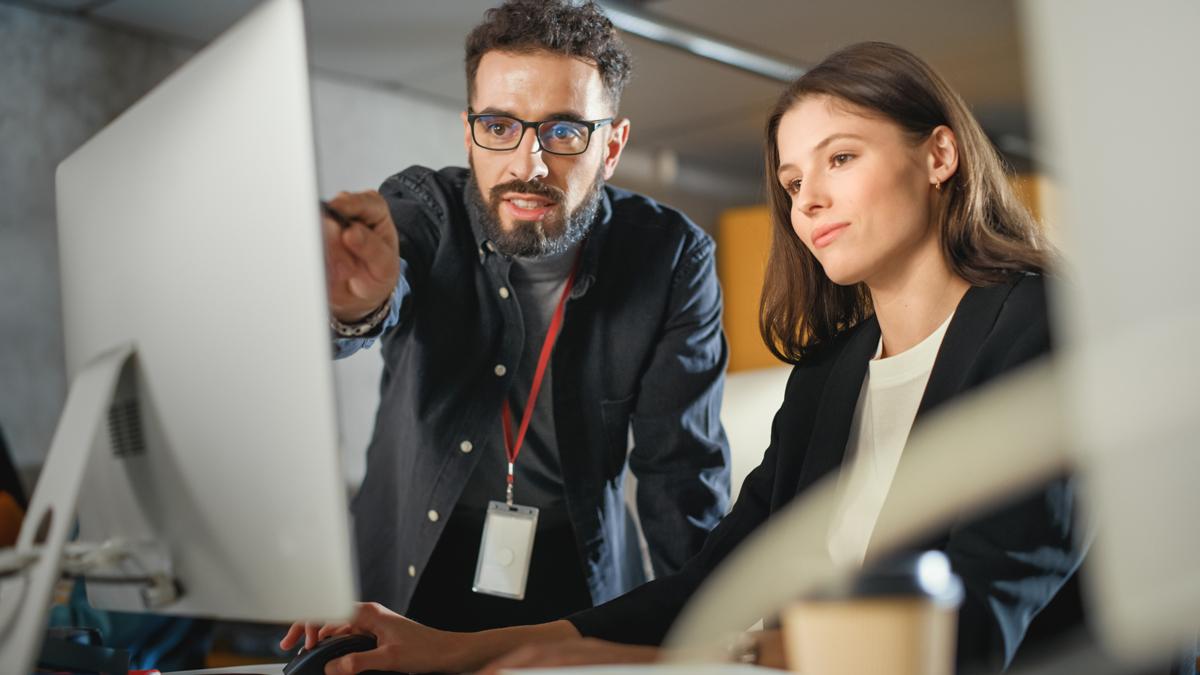 man and woman at computer