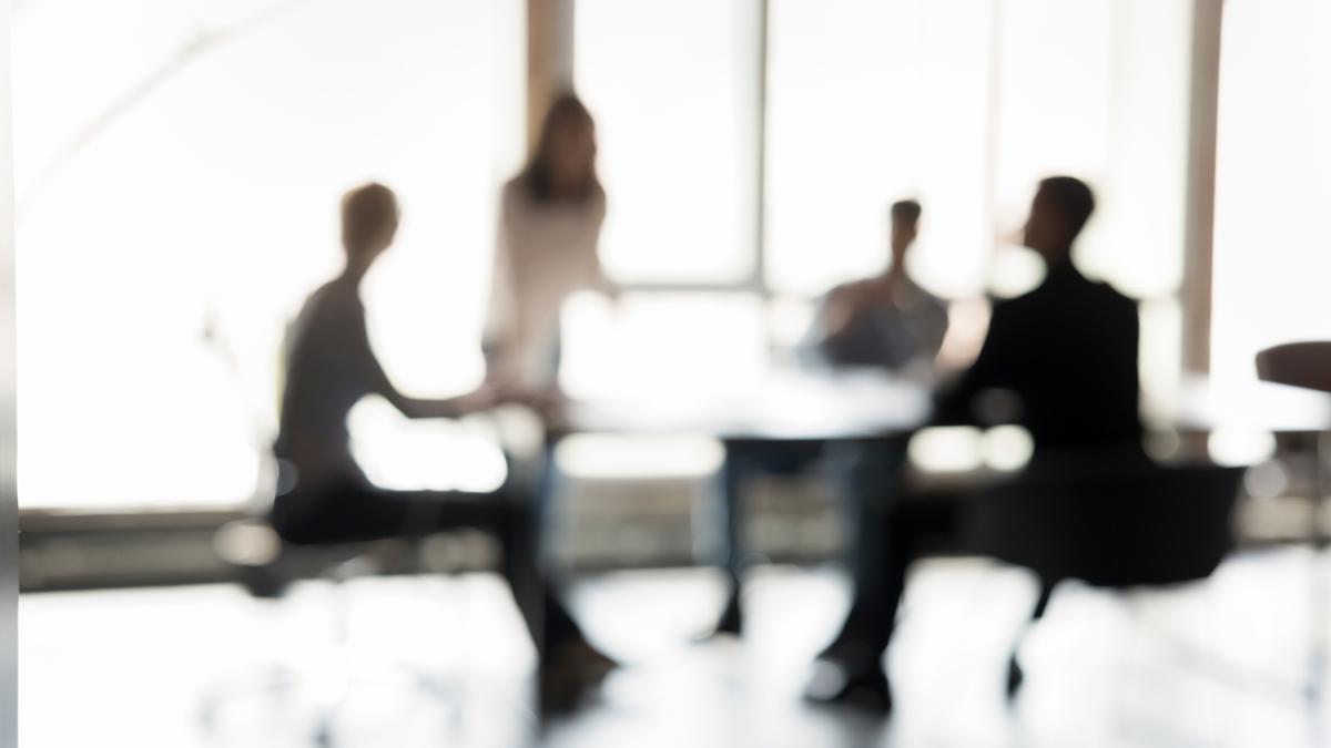 Blurred silhouettes of business people